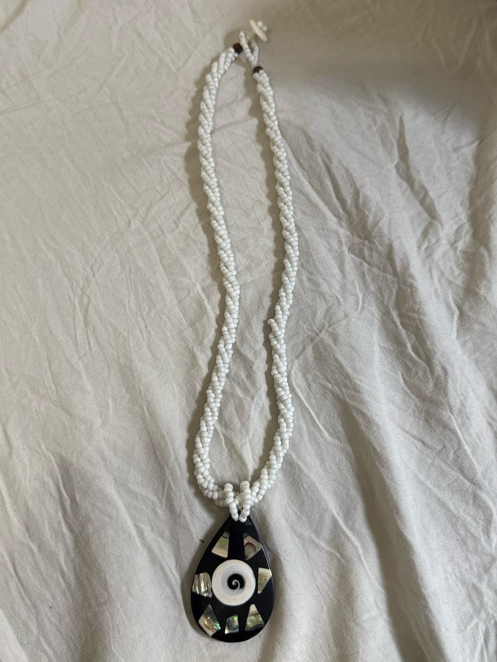 White Beaded Necklace with Black Teardrop Shell Pendant